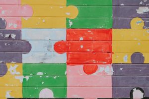 Colorful puzzle pattern on wooden surface